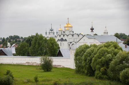 Big white Christian church in the village - Suzdal, Russiaの写真素材