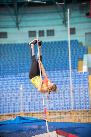 A female jumper in the stadium - pole vaultの写真素材
