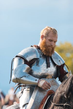 BULGAR, RUSSIA 11-08-2019: A bearded man knight riding a horseのeditorial素材