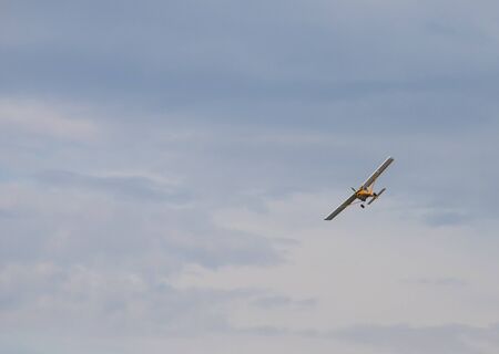 Army liaison aircraft flying in the skyの写真素材