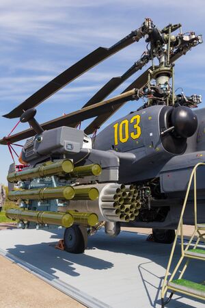 30 AUGUST 2019 MOSCOW, RUSSIA: Outdoors exhibition of airplanes - A helicopter in full armor and ammunitionのeditorial素材