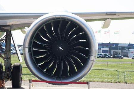 A big turbine of an airplane on the wing of the plane