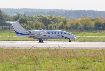 30 AUGUST 2019 MOSCOW, RUSSIA: A small passenger plane with side propellers riding on the runway