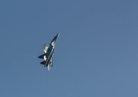 29 AUGUST 2019 MOSCOW, RUSSIA: A light green military fighter jet flying up in the sky