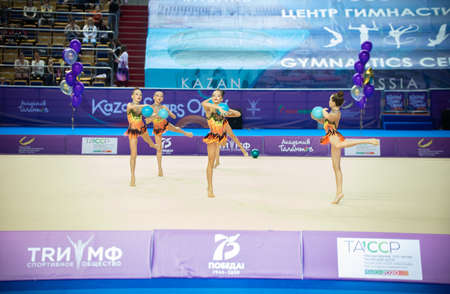 12-03-2020 KAZAN, RUSSIA: teen girls performing with balls on the gymnastic tournamentのeditorial素材