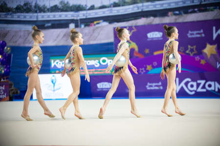 12-03-2020 KAZAN, RUSSIA: teen girls gymnasts walking off the stage on the gymnastic tournamentのeditorial素材