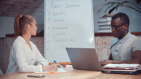 A woman and african-american man having an english class