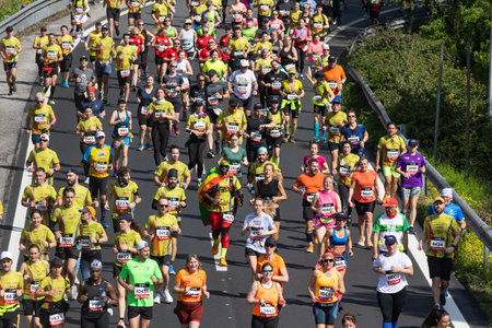March 12, 2023 Lisbon, Portugal: people in sports clothes run a marathonのeditorial素材