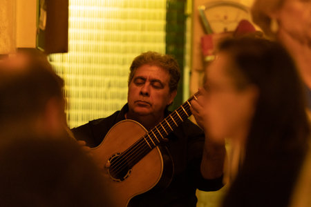 21 April 2023 Lisbon, Portugal: A baiuca cafe, Fado - national art of Portugal - sad song in restarantのeditorial素材