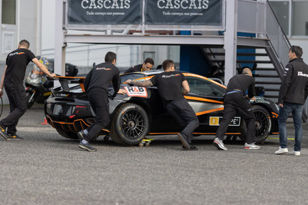 11-20-2022 PORTUGAL, LISBON: Caterham Festival Estoril - staff pushing the sports car for the next raceのeditorial素材