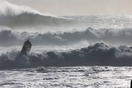 Marine sports activities - people ride jet skis and surf the waves