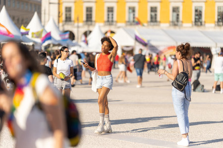 Lisbon, Portugal - 24 june 2023 - Terreiro do Paco Praca do Comercio: queer black man at LGBT pride festival wearing female clothesのeditorial素材
