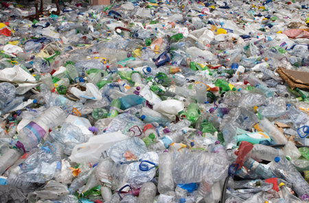 A bunch of empty plastic bottles in a landfill