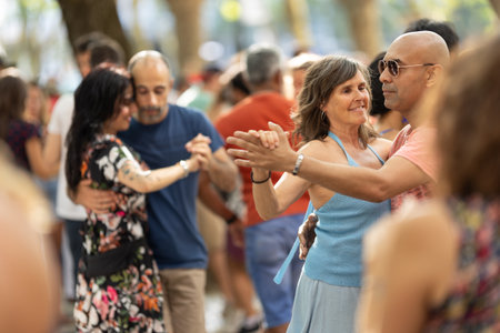 11 JUNE 2023, Lisbon, Portugal - Avenida da Liberdade: cute different couples dancing bachata on the street around other peopleのeditorial素材