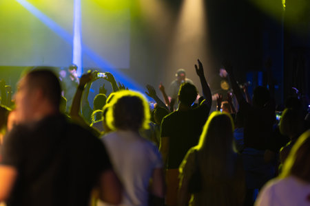 People enjoy a concert in a nightclubの写真素材