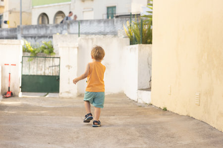 Little boy toddler walking outdoorsの写真素材