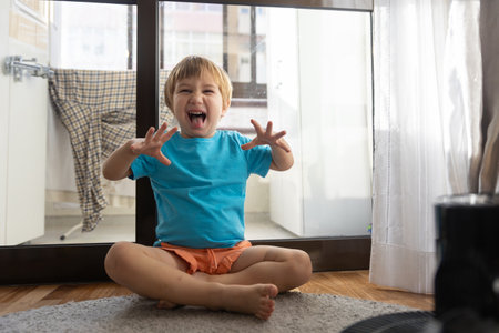 Photo of a Joyful Toddler Celebrating Lifes Small Victoriesの写真素材