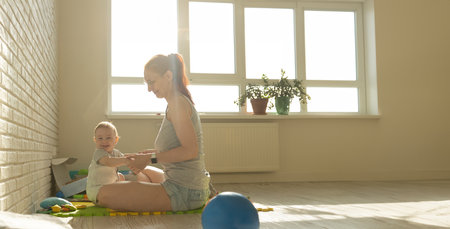 Mother and Her Baby Bonding at Homeの写真素材