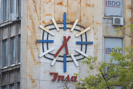 29 september 2023, Belgrade, Serbia - Wall clock - old stylish serbian constructionのeditorial素材
