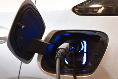 An Electric Car Charging at a Charger Station: The Future of Sustainable Transportation