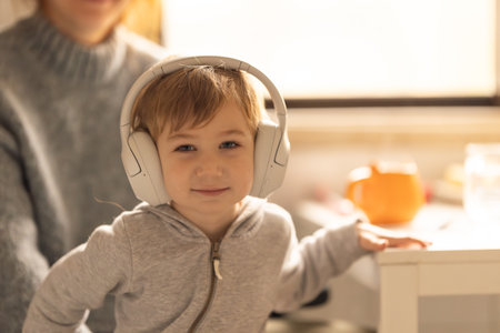 A Boy and Woman Listening to Music Togetherの写真素材