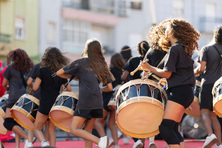 A group of women are playing drums and dancingの写真素材