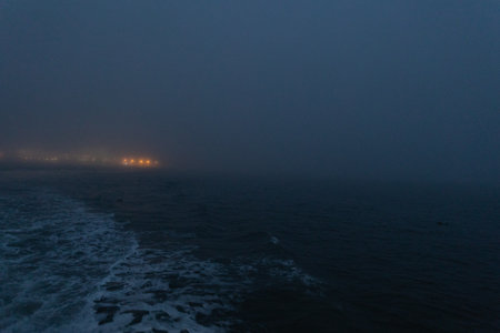 Foggy calm sea in the late eveningの写真素材