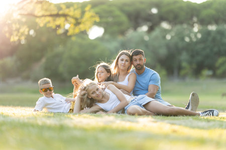 Family enjoying leisure time in the parkの写真素材