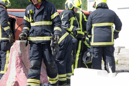 Firefighters intervening on a car accident are securing the area