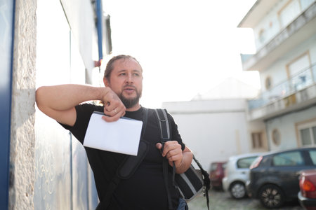 Tourist looking for directions in european city during summer vacation