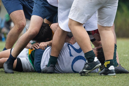Rugby players forming a ruck during a matchの写真素材