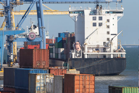 Industrial ship at the port with containersの写真素材
