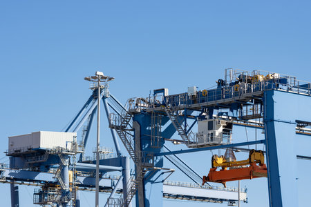 Large lifting structures with suspended spreader for cargo containersの写真素材