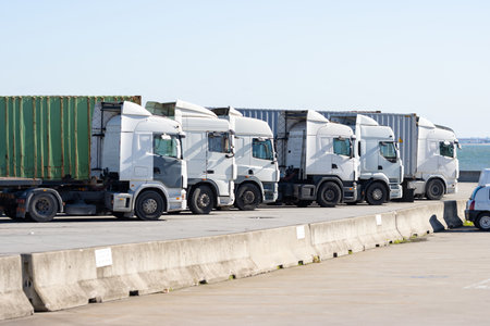 Trucks stand in a row near the seaportの写真素材