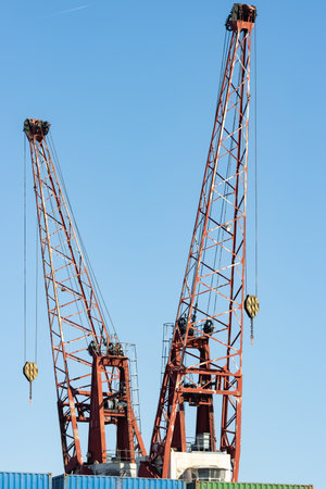 Cranes in the seaport for lifting cargoの写真素材