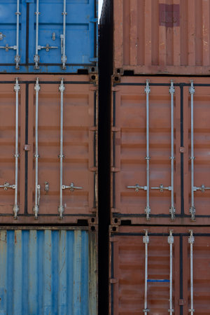 Closed doors of multicolored cargo containers in the portの写真素材