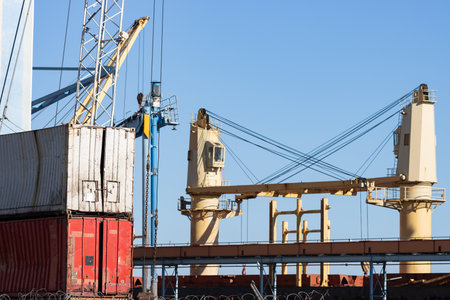 Seaport and cargo containers under the blue sky