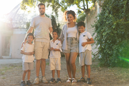 Happy family posing together in a parkの写真素材