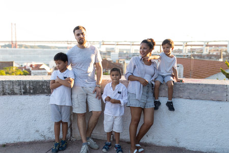 Happy family enjoying view of lisbon cityscape with 25 de abril bridge in background