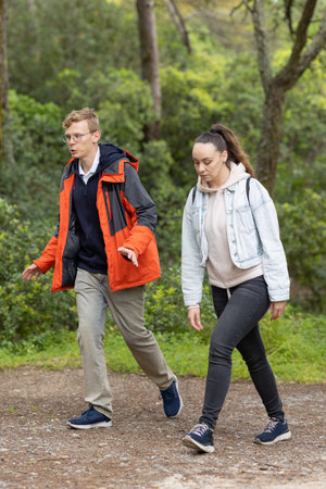 Young couple walking on a path in nature