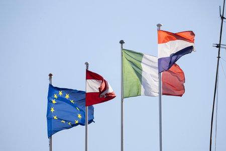 European union, austria, italy, netherlands flags waving in windの写真素材