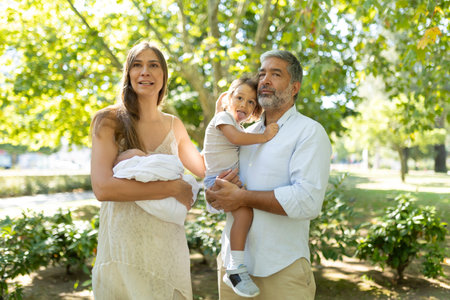 Happy mixed age family enjoying quality time outdoors togetherの写真素材