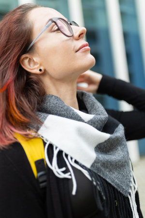 Young woman enjoying warm sun rays outdoors