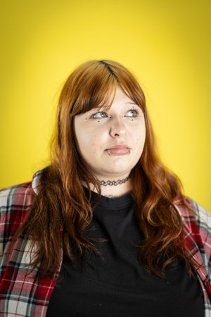Young woman looking up with thoughtful expression
