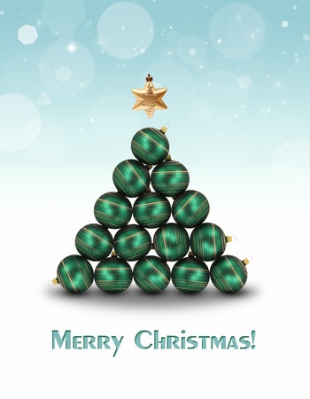 Abstract illustration  Green ornaments and a golden star topper are building a christmas tree on a light blue bokeh background の写真素材