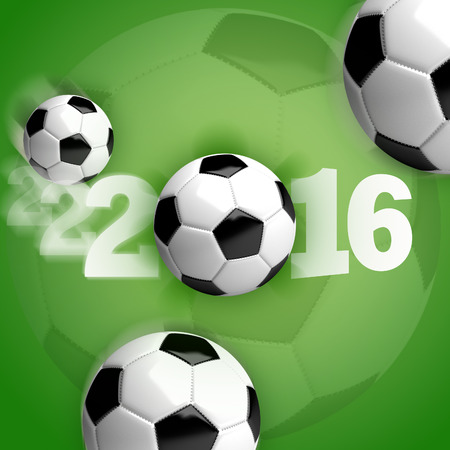 Soccer balls (footballs) in motion on a green background with white lettering "2016".の写真素材