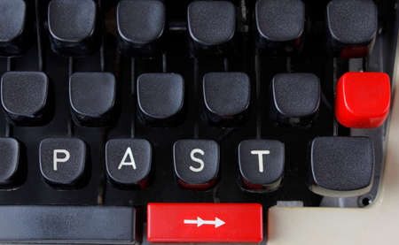  closeup of an old fashioned typewriter with the words  PAST  clearly visible 