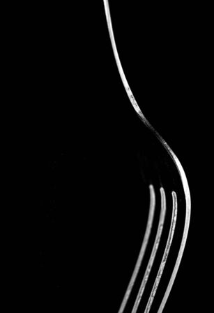 fork isolated on black backgroundの写真素材