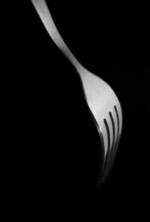 fork isolated on black background