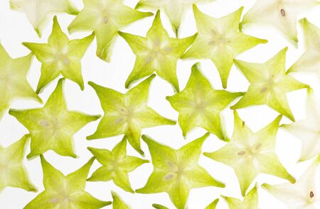 Green carambola fruit isolated white background top view.の写真素材